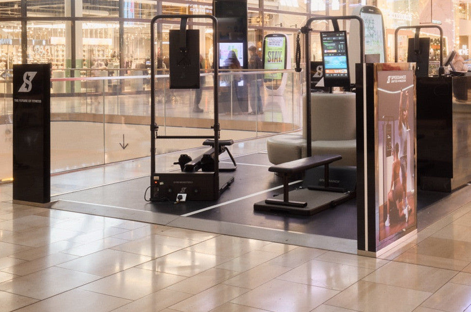 A Speediance showroom pod in a shopping centre