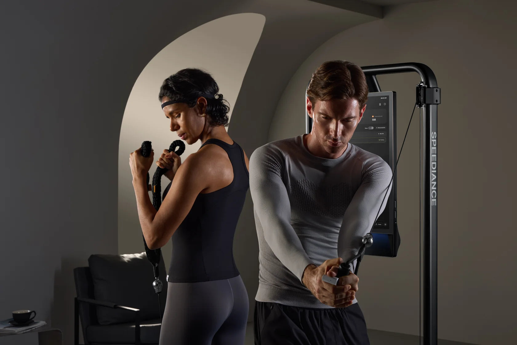 Two adults training together on Gym Monster 3