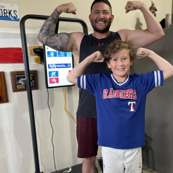 Tommy Schumpert with his son, from his Speediance owner story