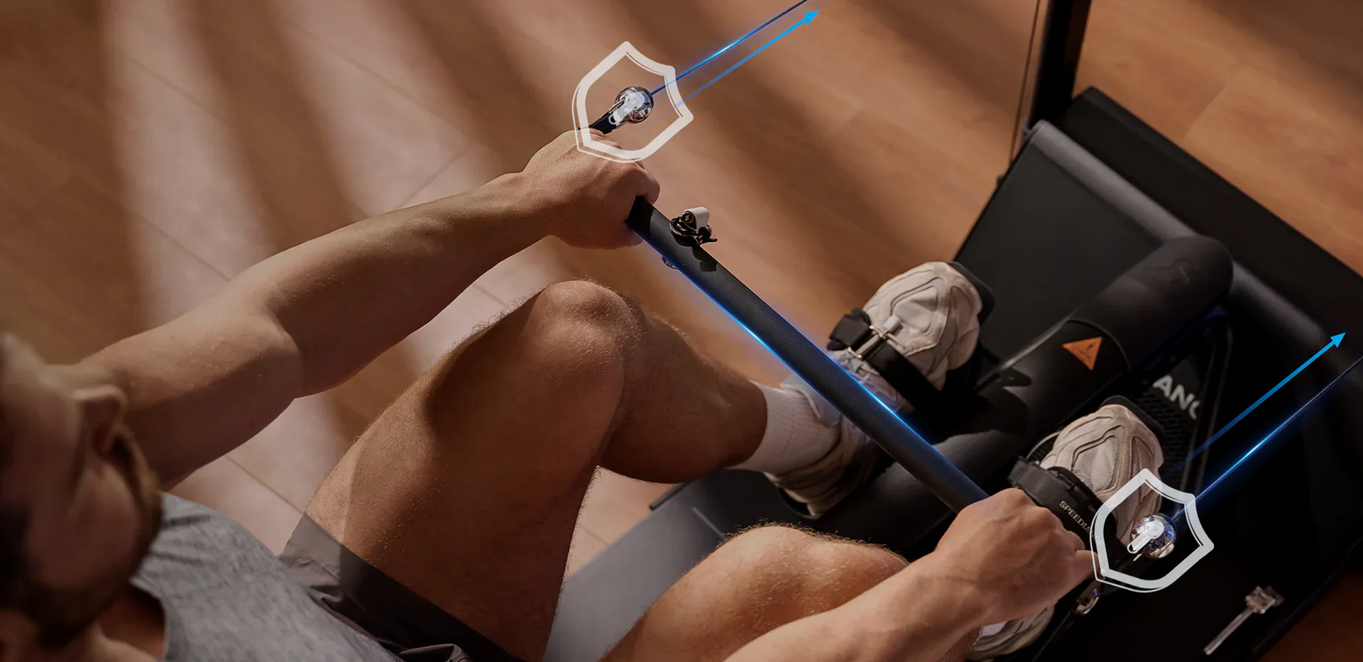 Person using a rowing machine with digital display and graphics overlay