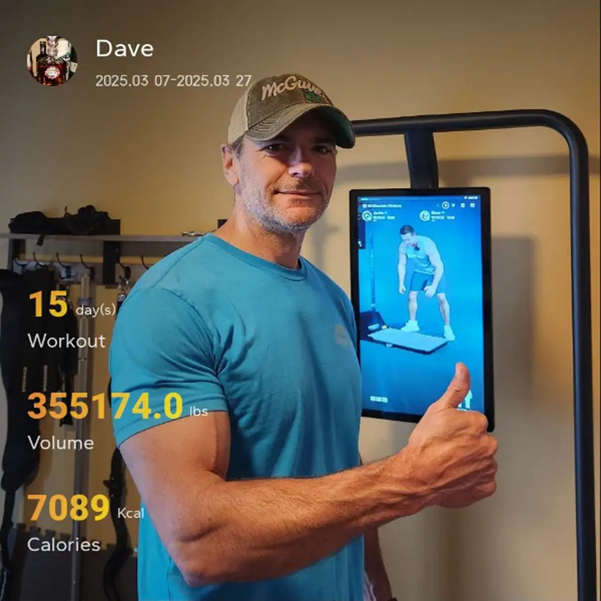 Man in a gym setting with fitness tracking app on screen