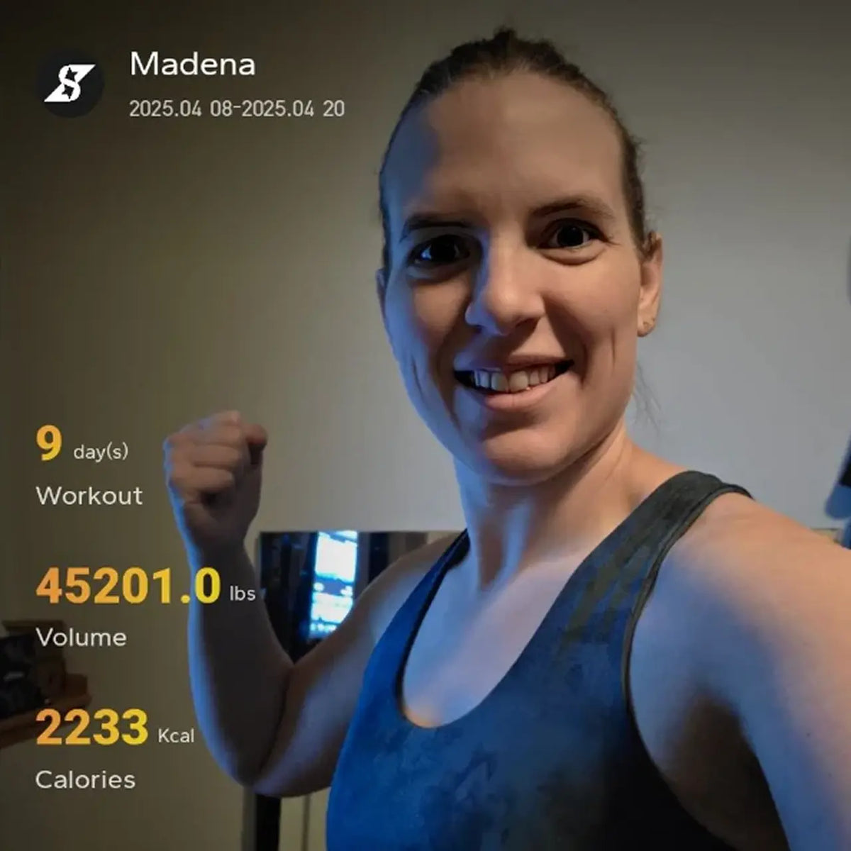 Woman in a gym setting with fitness stats displayed on screen