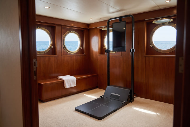 Gym&nbsp;Monster&nbsp;3 in a mahogany-panelled yacht cabin