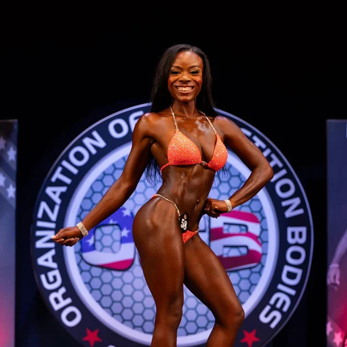 Tasha on stage at her bodybuilding competition