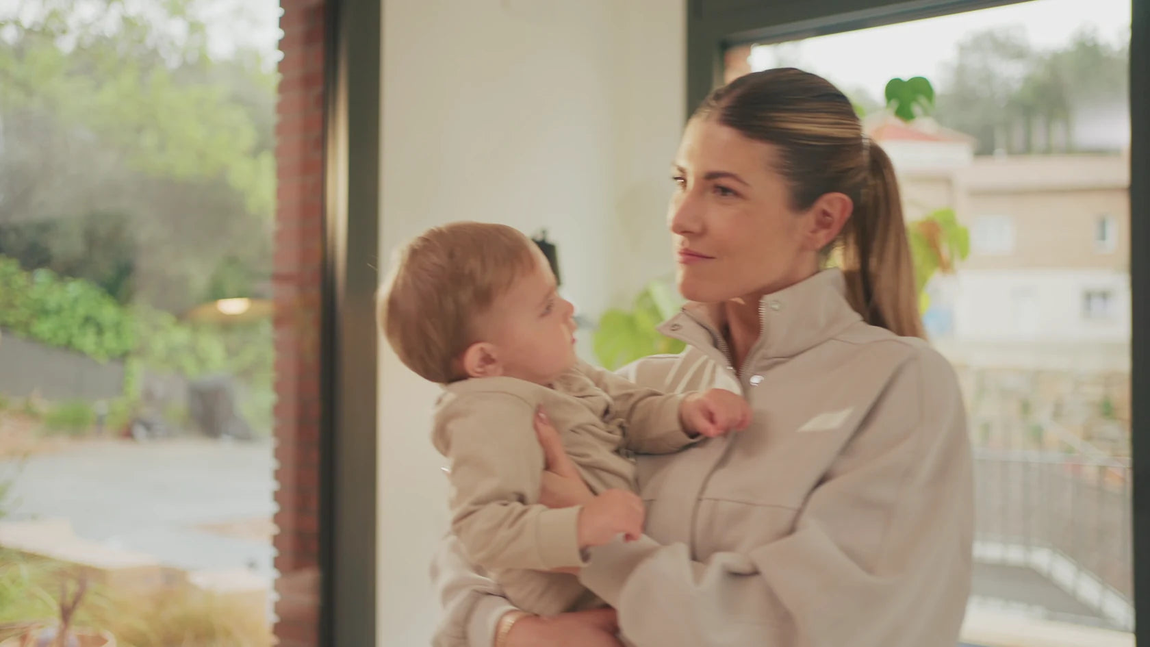 A mother sharing a quiet moment with her baby at home, from Speediance's family film